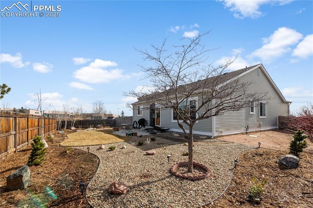 rear view of property featuring a patio area