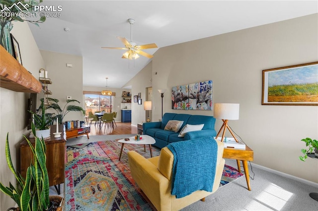 carpeted living room with vaulted ceiling and ceiling fan