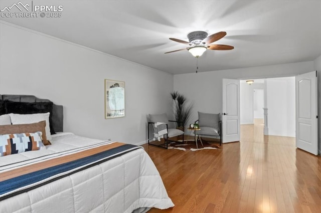 bedroom featuring hardwood / wood-style flooring and ceiling fan