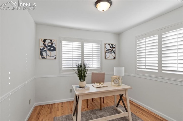 home office featuring hardwood / wood-style floors