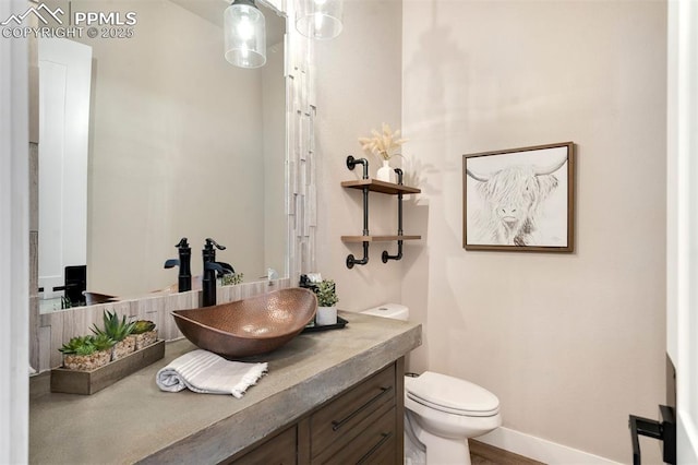 bathroom with vanity and toilet