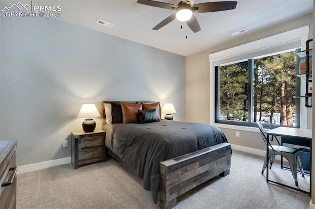 bedroom featuring ceiling fan and light carpet