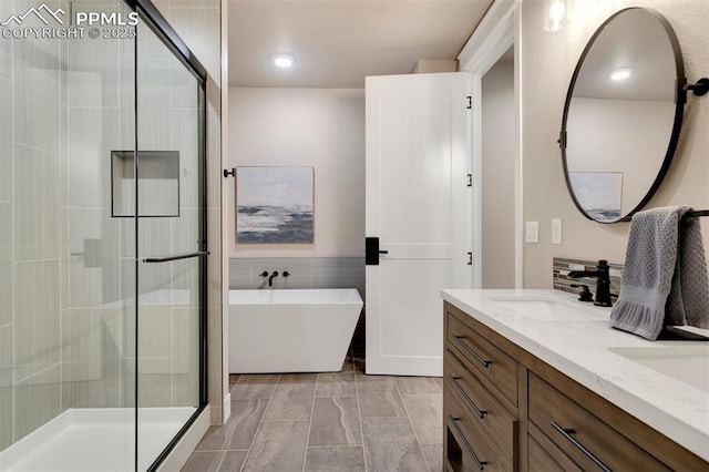 bathroom featuring vanity and plus walk in shower