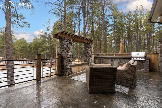 view of patio / terrace featuring grilling area and an outdoor kitchen