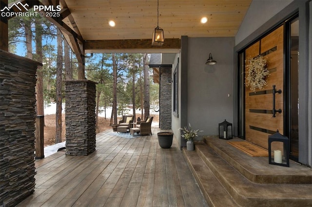 wooden terrace featuring an outdoor hangout area