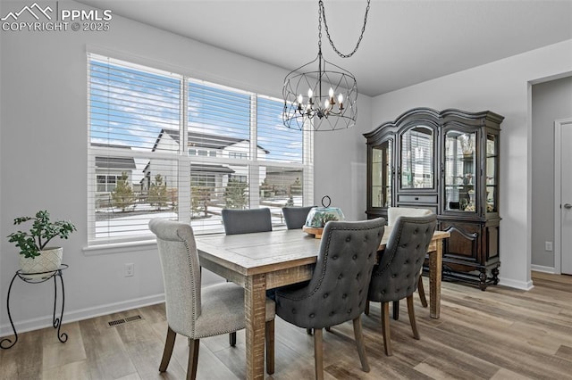 dining area with plenty of natural light and light wood-type flooring