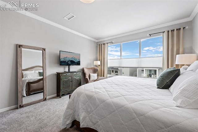 bedroom with ornamental molding and carpet flooring