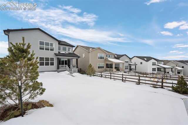 view of snow covered property