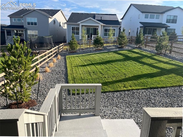 view of yard with a trampoline