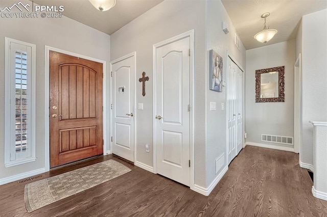 entrance foyer with dark hardwood / wood-style floors