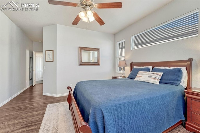 bedroom with dark wood-type flooring and ceiling fan