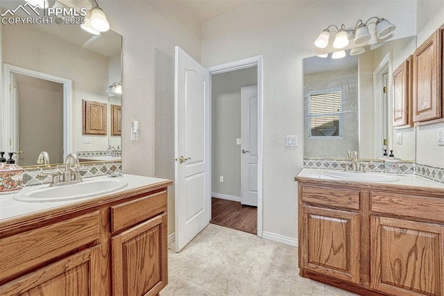 bathroom featuring vanity and decorative backsplash