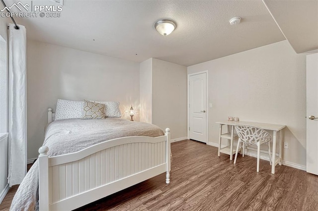 bedroom featuring wood-type flooring