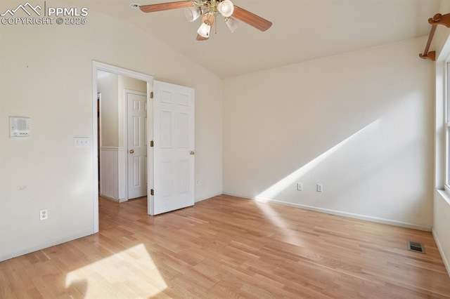 unfurnished room featuring vaulted ceiling, light hardwood / wood-style floors, and ceiling fan