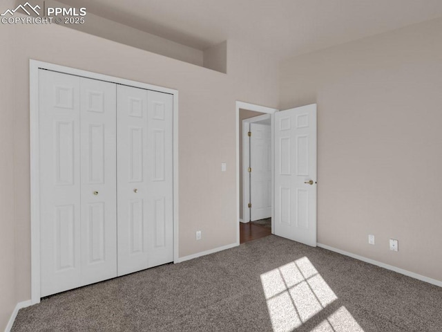 unfurnished bedroom featuring a closet and carpet flooring