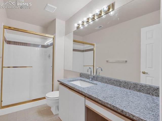 bathroom with toilet, vanity, and walk in shower