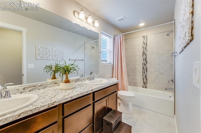 full bathroom featuring vanity, shower / bathtub combination with curtain, tile patterned floors, and toilet