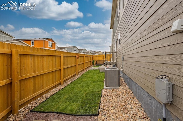 view of yard with central AC unit