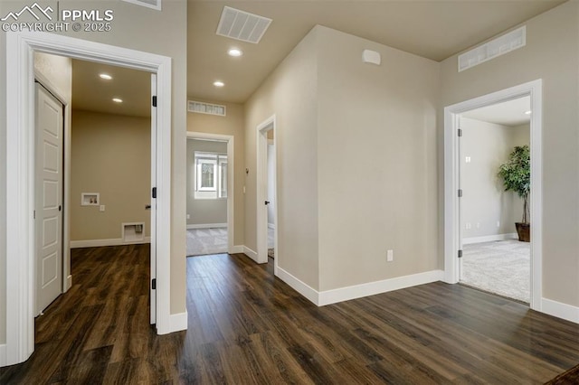 hall with dark hardwood / wood-style floors