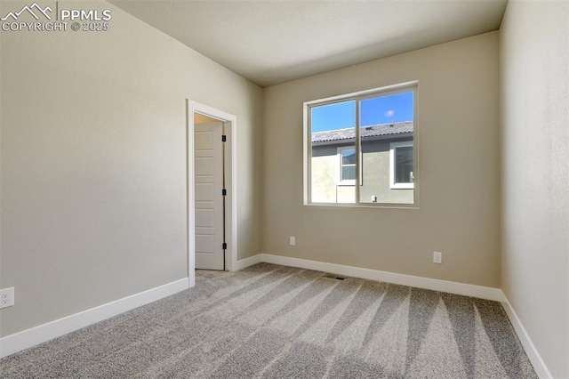 view of carpeted spare room