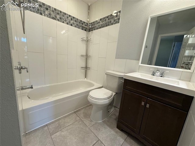 full bathroom featuring vanity, tile patterned flooring, toilet, and shower / bath combination