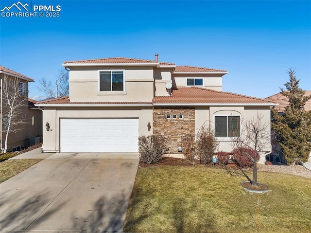 mediterranean / spanish-style house featuring a garage and a front lawn