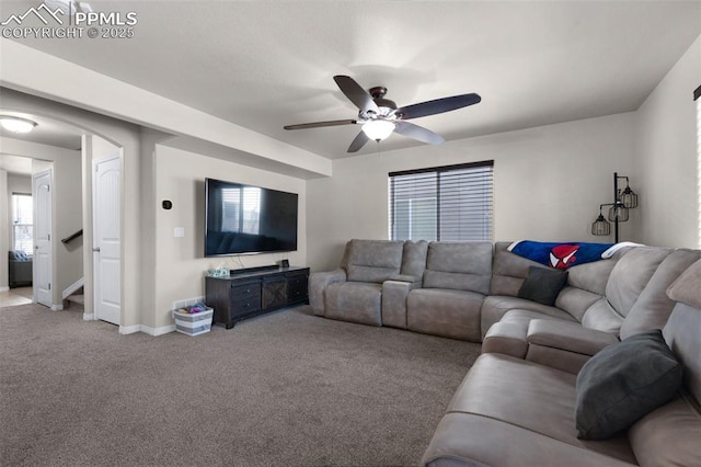 living room with ceiling fan and light carpet