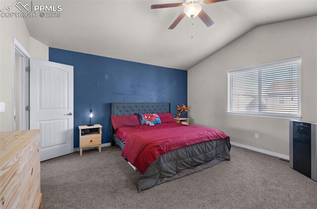 carpeted bedroom with vaulted ceiling and ceiling fan