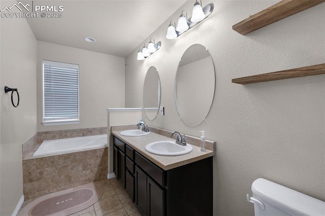 bathroom featuring toilet, vanity, tiled bath, and tile patterned flooring