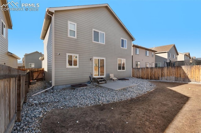 back of house with a patio