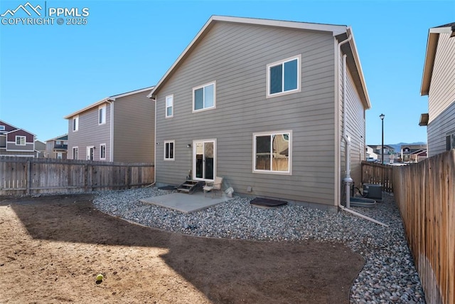 back of house featuring a patio area