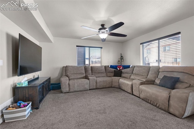 living room featuring a healthy amount of sunlight, light colored carpet, and ceiling fan