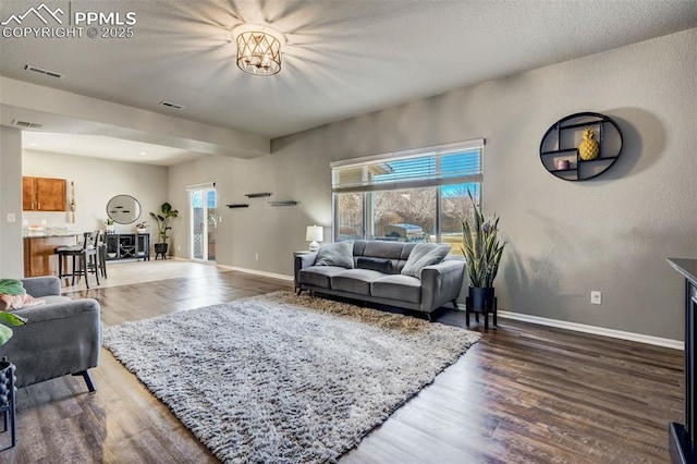 living room featuring dark hardwood / wood-style flooring