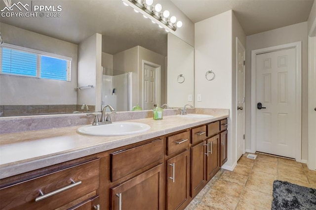 bathroom with tile patterned flooring and vanity