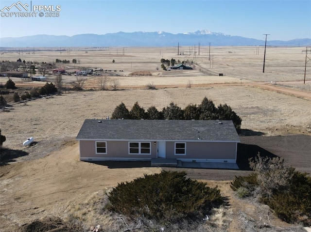 drone / aerial view featuring a rural view and a mountain view