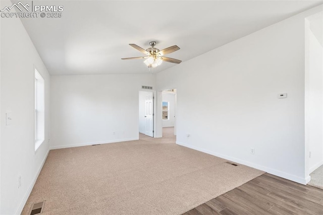 spare room featuring ceiling fan and light hardwood / wood-style flooring