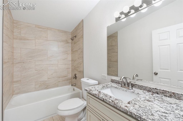 full bathroom with tiled shower / bath combo, vanity, and toilet