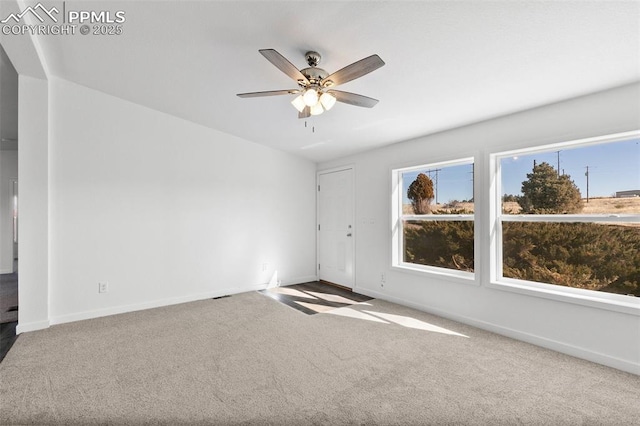 carpeted empty room with ceiling fan