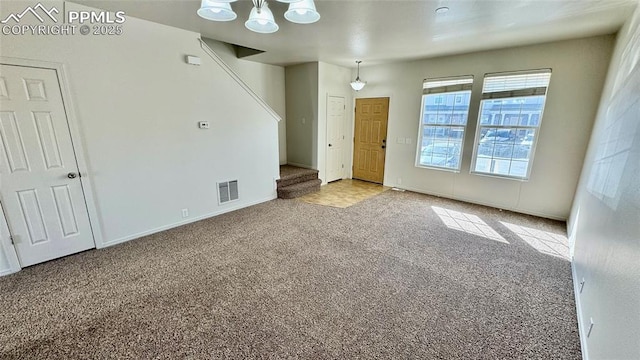 empty room with light colored carpet