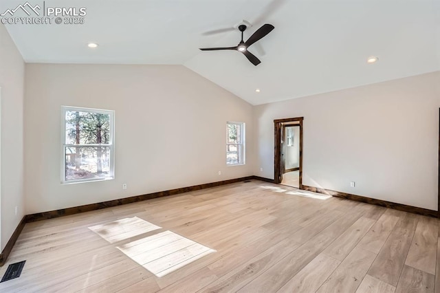 unfurnished room with light hardwood / wood-style flooring, vaulted ceiling, and ceiling fan