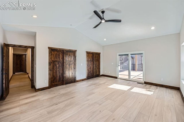 unfurnished bedroom with light hardwood / wood-style flooring, ceiling fan, access to exterior, vaulted ceiling, and multiple closets