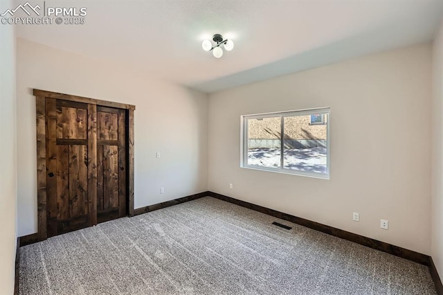 unfurnished bedroom with carpet floors