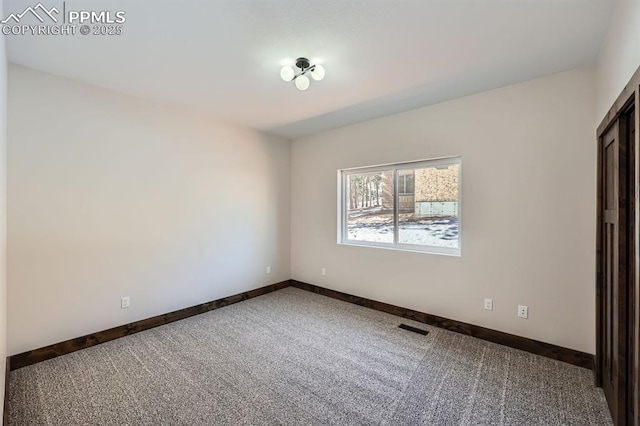 spare room with carpet flooring