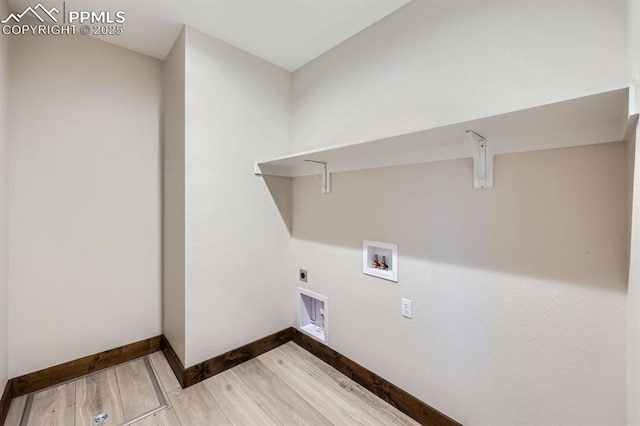 laundry room with hardwood / wood-style flooring and washer hookup