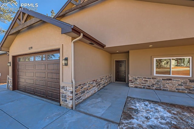 doorway to property featuring a garage