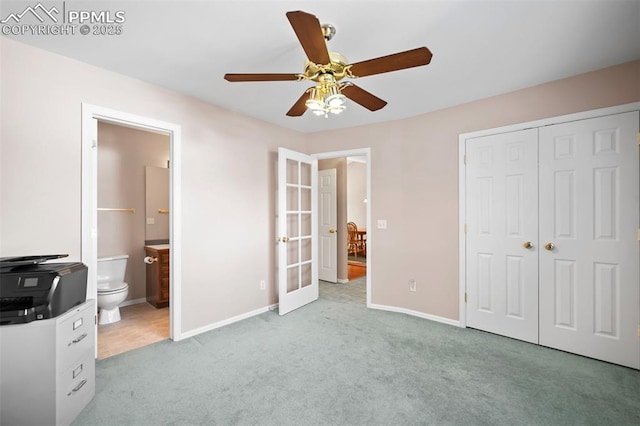 bedroom with ceiling fan, a closet, french doors, and light colored carpet