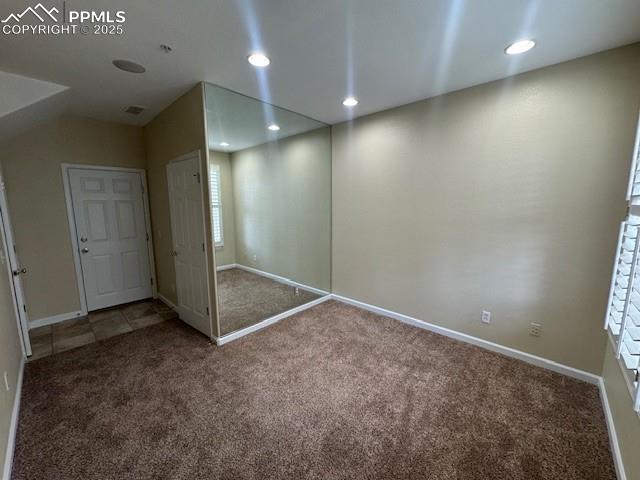 unfurnished bedroom with carpet flooring