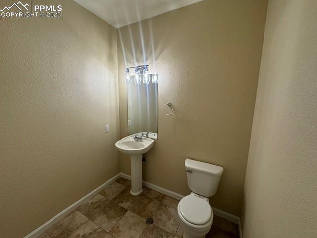 bathroom featuring toilet