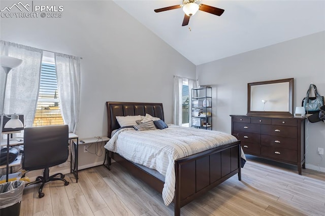 bedroom with high vaulted ceiling, ceiling fan, and light wood-type flooring