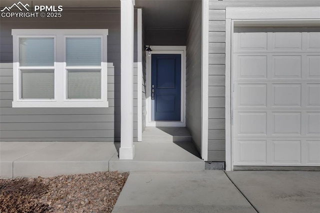 entrance to property featuring a garage